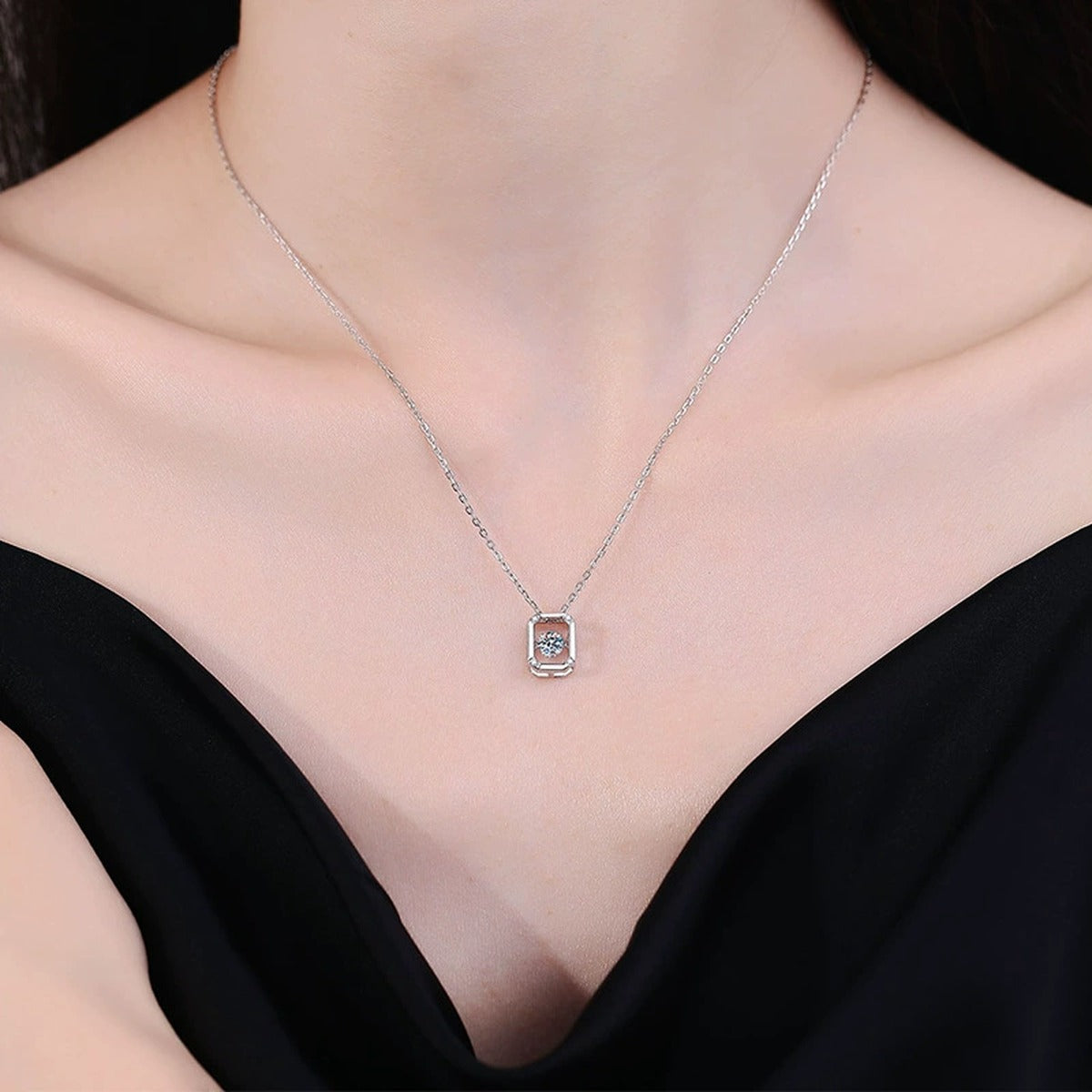 Emerald-Cut Halo Moissanite Pendant Necklace in Platinum-Plated S925 Sterling Silver worn on neckline by model
