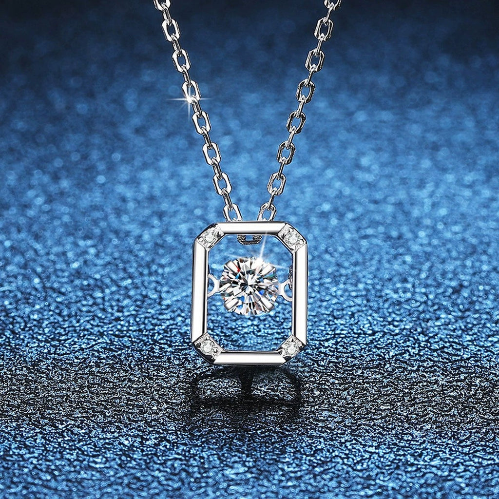 Emerald-Cut Halo Moissanite Pendant Necklace in Platinum-Plated S925 Sterling Silver blue background angled view