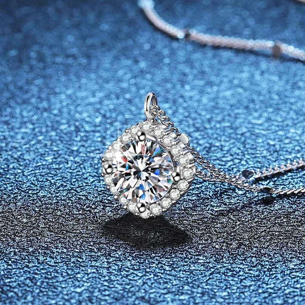 Cushion Halo Moissanite Pendant Necklace in Platinum-Plated S925 Sterling Silver blue background close-up view