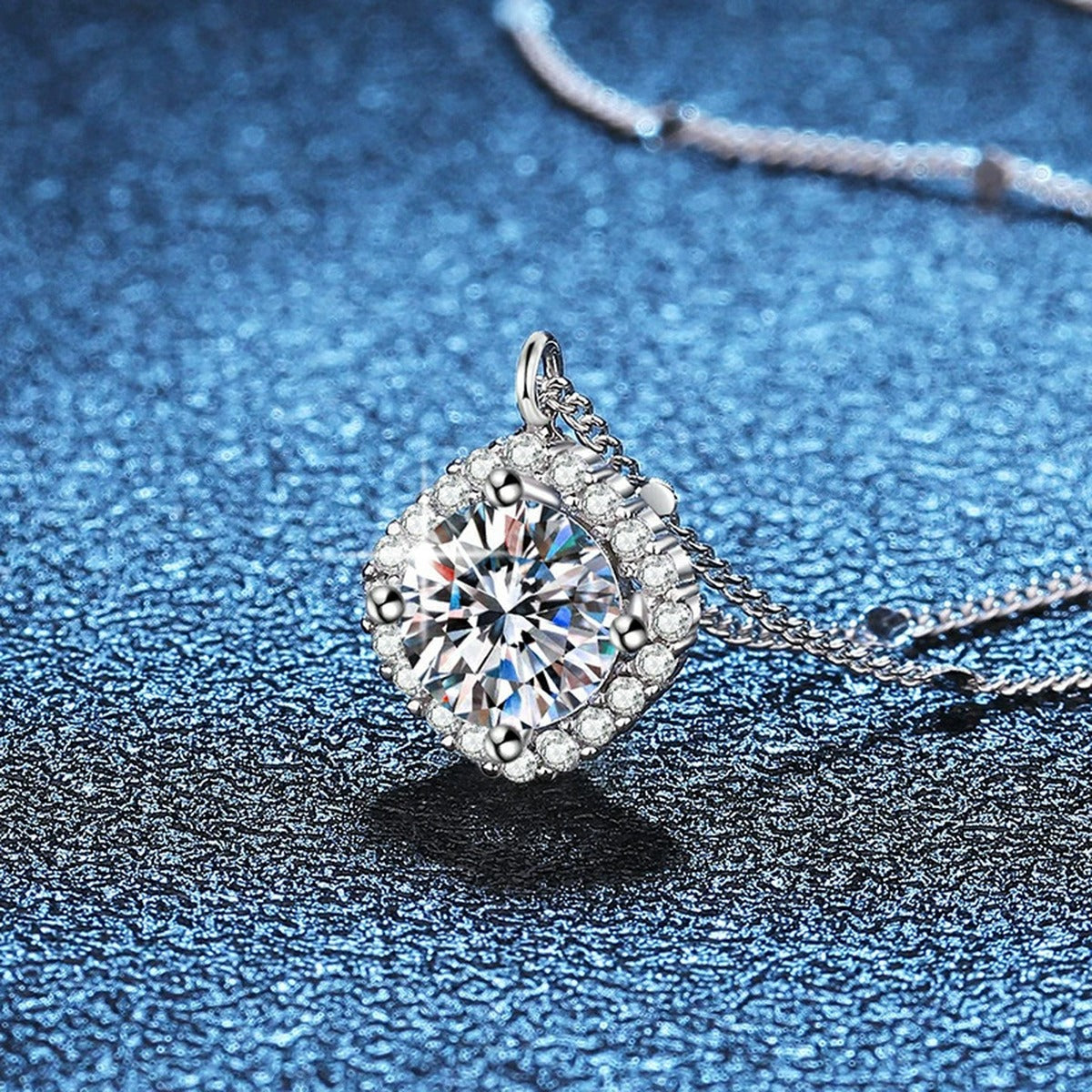 Cushion Halo Moissanite Pendant Necklace in Platinum-Plated S925 Sterling Silver blue background close-up view