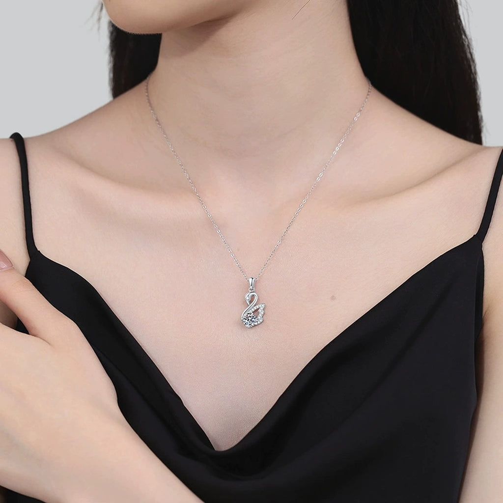 Swan Moissanite Pendant Necklace in Platinum-Plated S925 Sterling Silver worn on neckline by model
