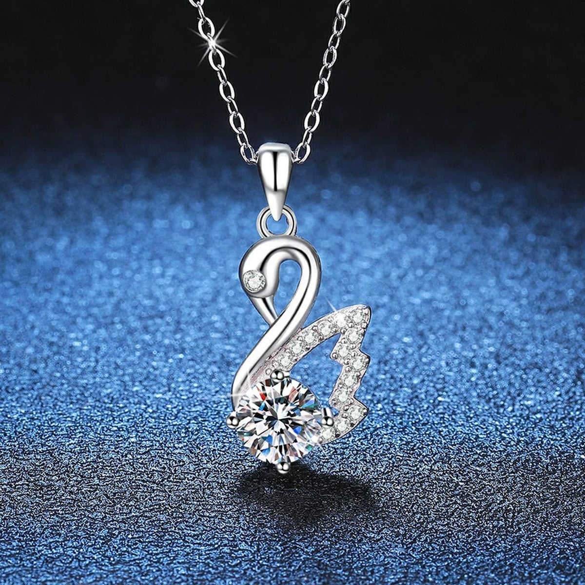 Swan Moissanite Pendant Necklace in Platinum-Plated S925 Sterling Silver blue background close-up view