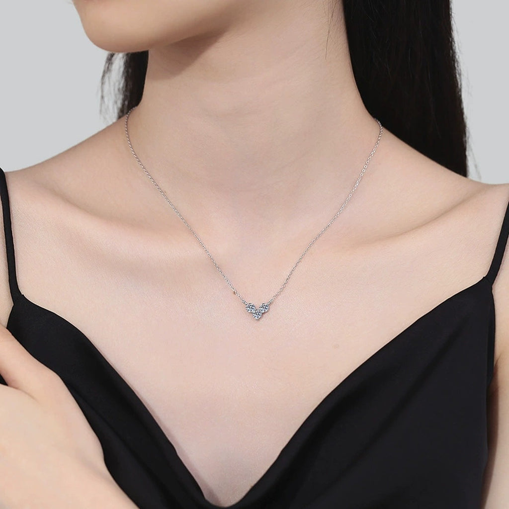 Three-Stone Moissanite Station Necklace in Platinum-Plated S925 Sterling Silver worn on neckline by model