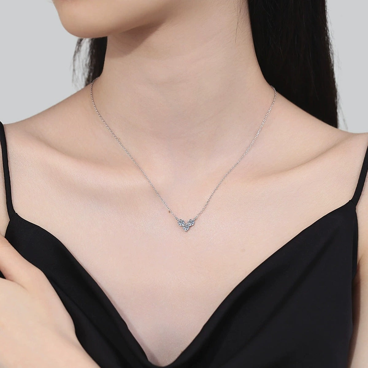 Three-Stone Moissanite Station Necklace in Platinum-Plated S925 Sterling Silver worn on neckline by model