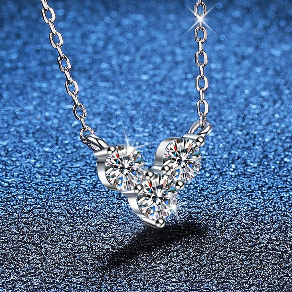 Three-Stone Moissanite Station Necklace in Platinum-Plated S925 Sterling Silver blue background angled view