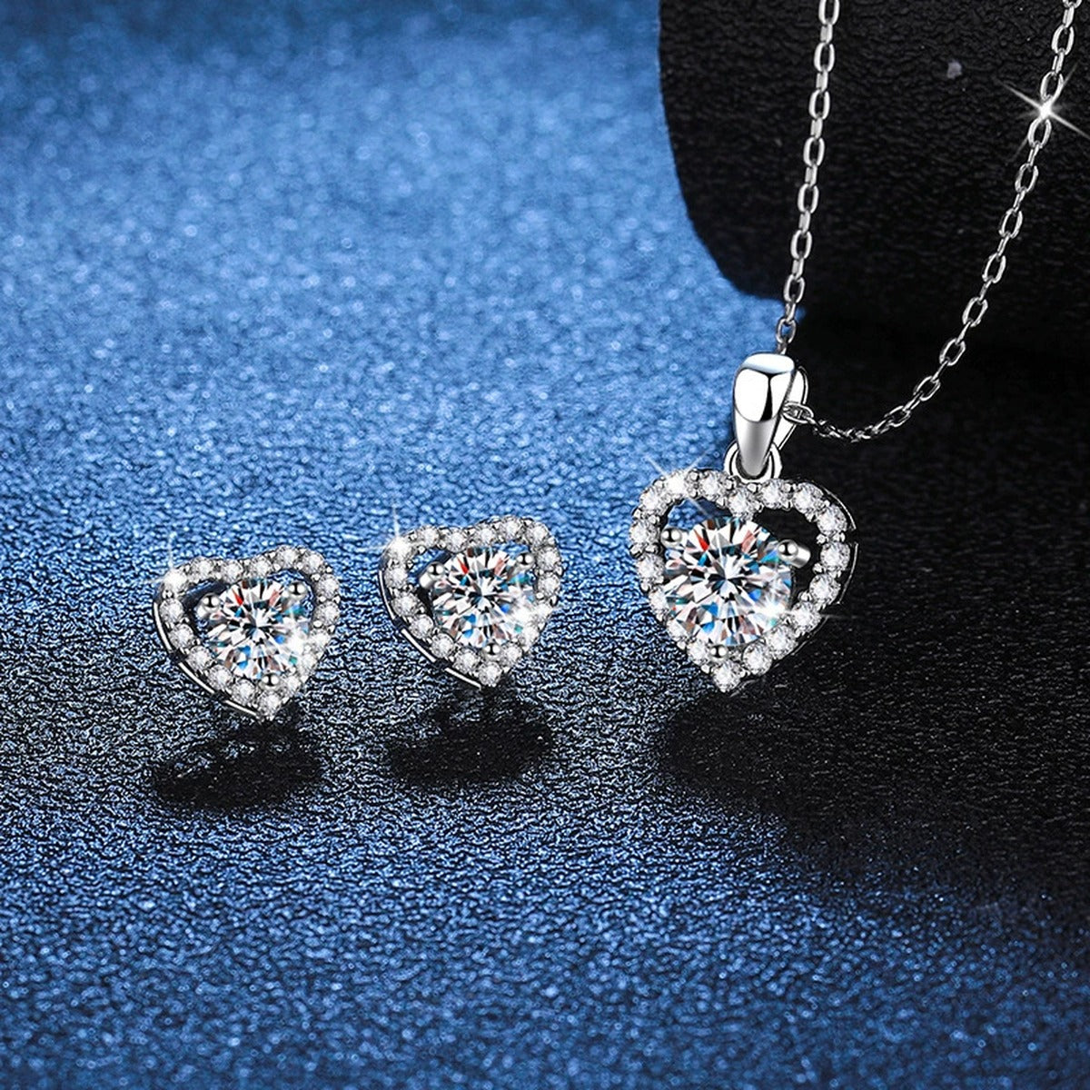Heart Halo Moissanite Jewelry Style in Platinum-Plated S925 Sterling Silver blue background angled view