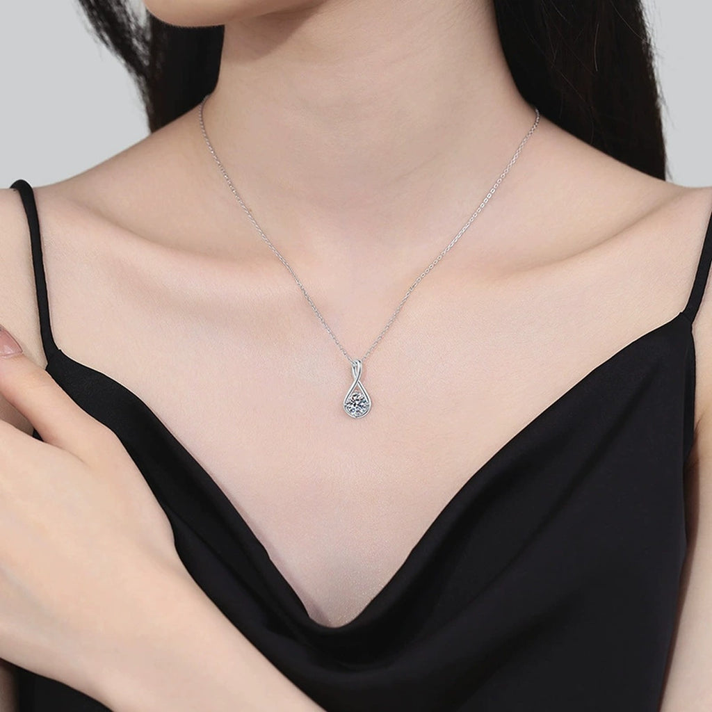 Teardrop Moissanite Pendant Necklace in Platinum-Plated S925 Sterling Silver worn on neckline by model