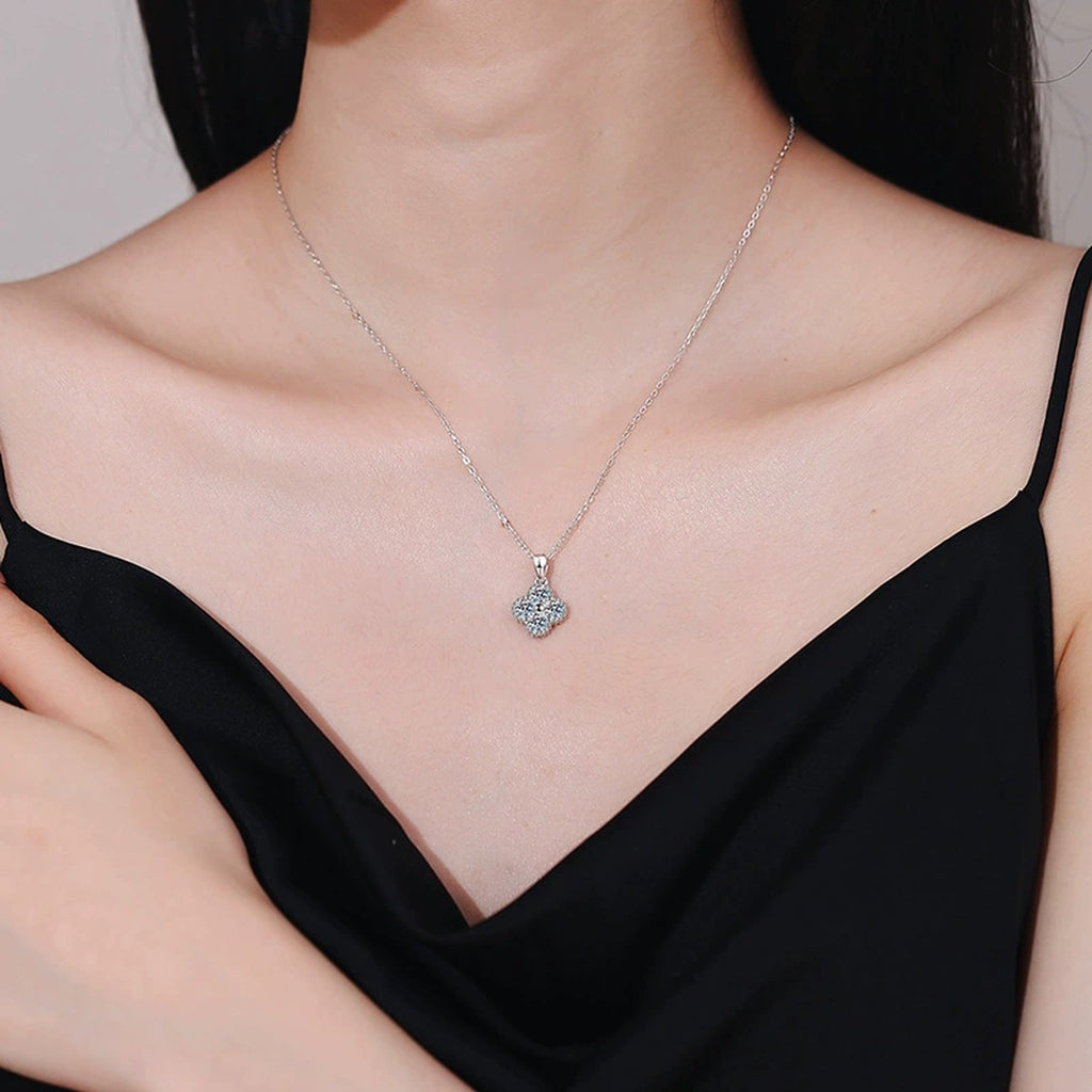 Four-Stone Cluster Moissanite Pendant Necklace in Platinum-Plated S925 Sterling Silver worn on neckline by model