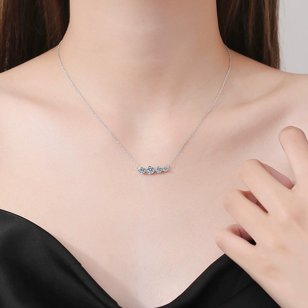 Four-Stone Moissanite Station Necklace in Platinum-Plated S925 Sterling Silver worn on neckline by model