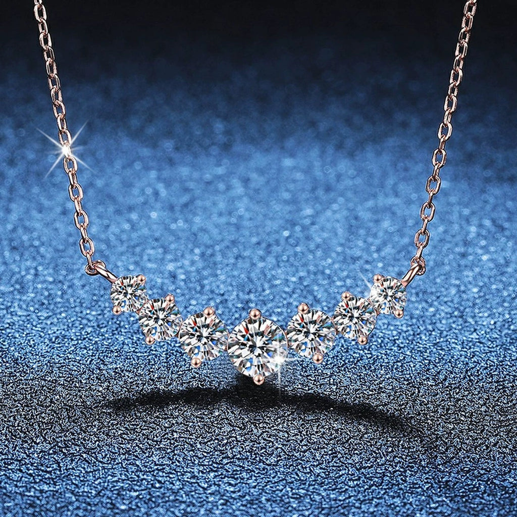 Graduated Moissanite Collar Necklace in Rose Gold-Plated S925 Sterling Silver blue background angled view