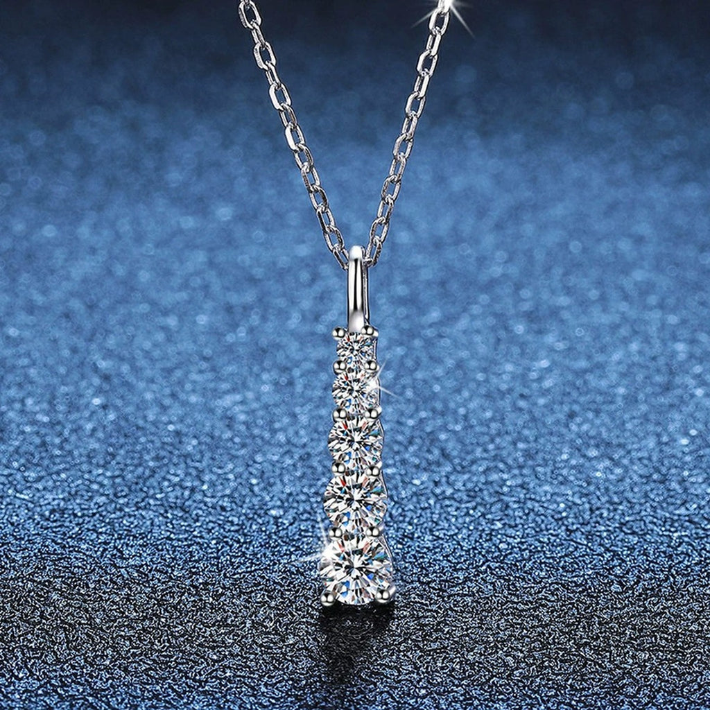 Tapered Bar Moissanite Pendant Necklace in Platinum-Plated S925 Sterling Silver blue background angled view