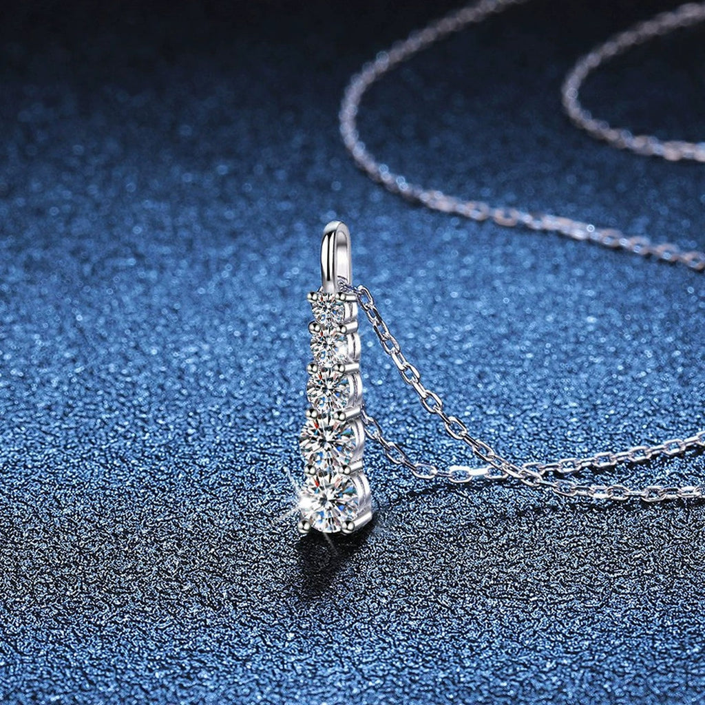Tapered Bar Moissanite Pendant Necklace in Platinum-Plated S925 Sterling Silver blue background close-up view