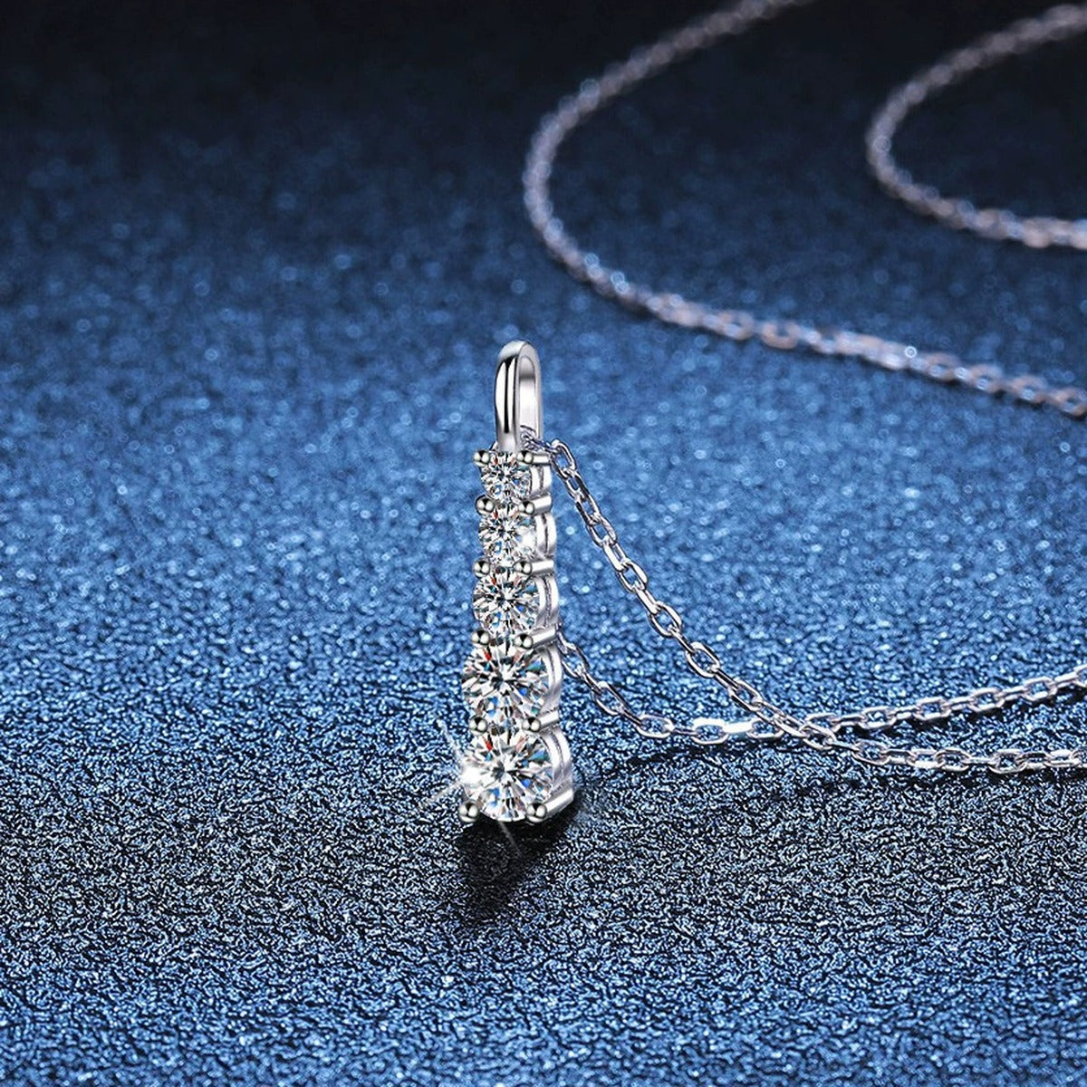 Tapered Bar Moissanite Pendant Necklace in Platinum-Plated S925 Sterling Silver blue background close-up view