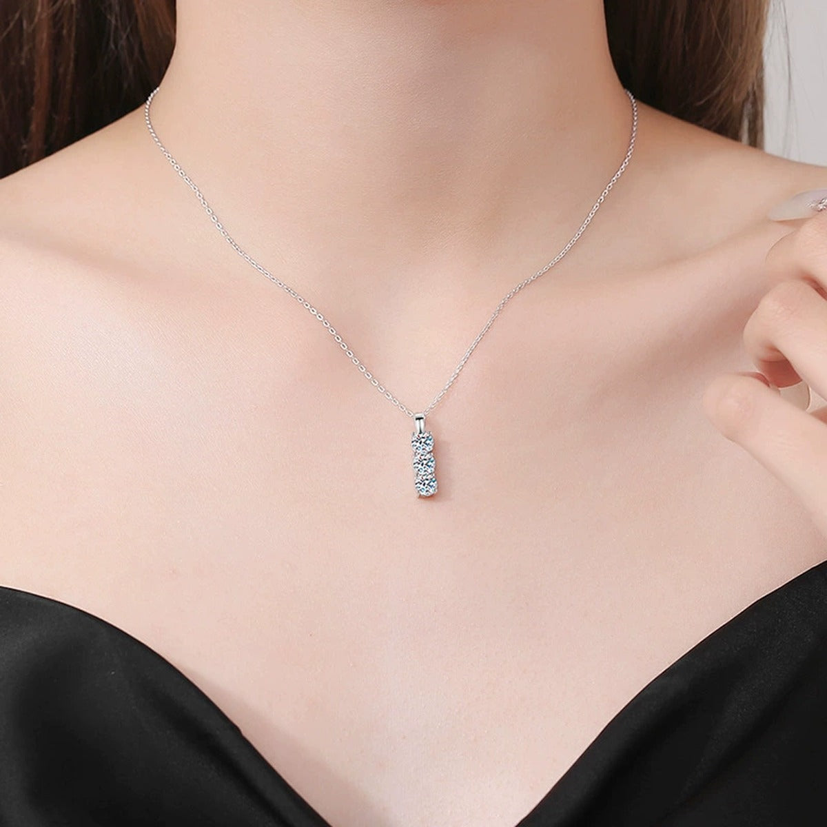 Three-Stone Bar Moissanite Pendant Necklace in Platinum-Plated S925 Sterling Silver worn on neckline by model