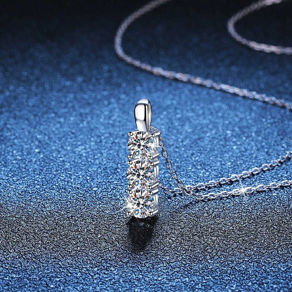 Three-Stone Bar Moissanite Pendant Necklace in Platinum-Plated S925 Sterling Silver blue background angled view