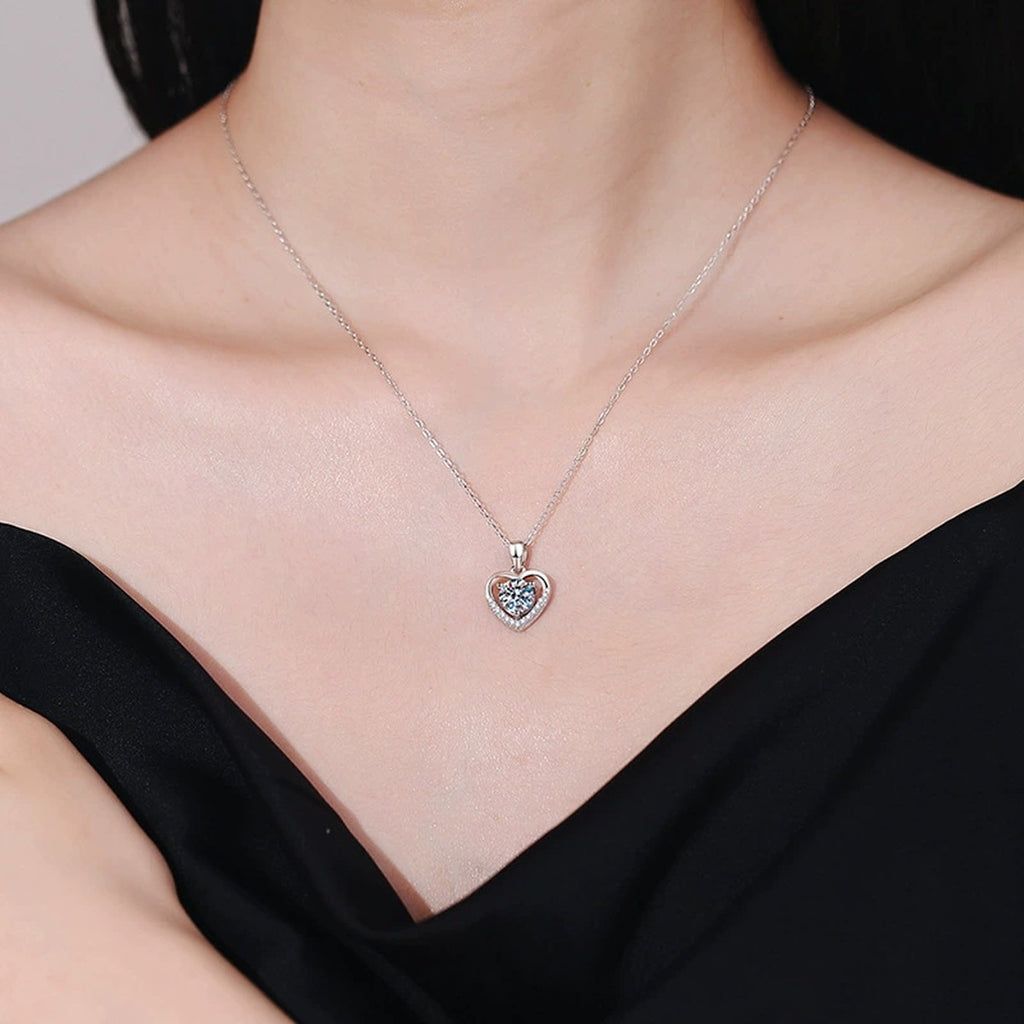 Heart Halo Moissanite Pendant Necklace in Platinum-Plated S925 Sterling Silver worn on neckline by model