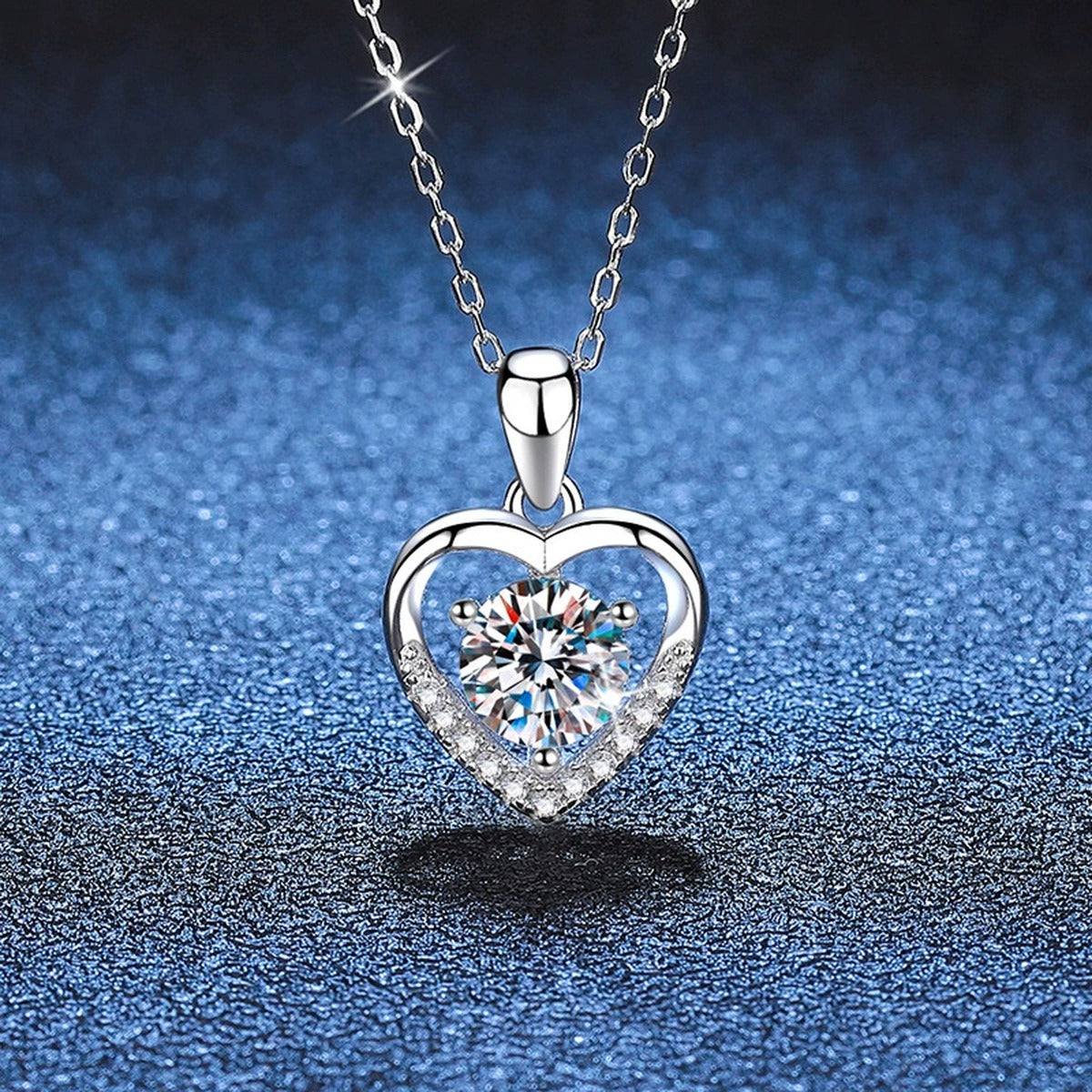 Heart Halo Moissanite Pendant Necklace in Platinum-Plated S925 Sterling Silver blue background angled view