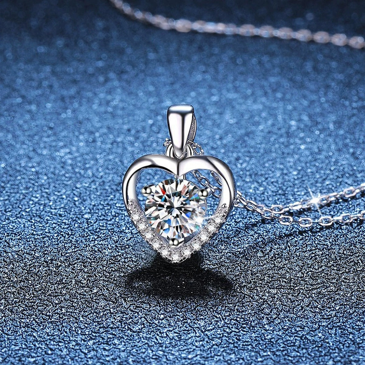 Heart Halo Moissanite Pendant Necklace in Platinum-Plated S925 Sterling Silver blue background close-up view