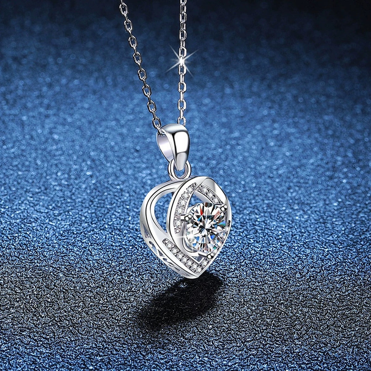 Open Heart Halo Moissanite Pendant Necklace in Platinum-Plated S925 Sterling Silver blue background close-up view