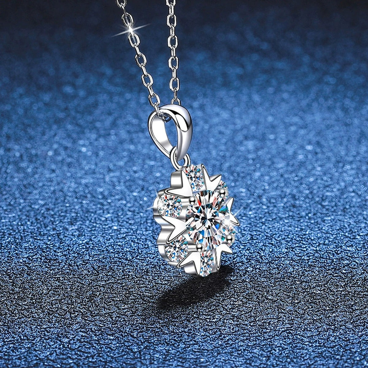 Floral Cluster Moissanite Pendant Necklace in Platinum-Plated S925 Sterling Silver blue background angled view