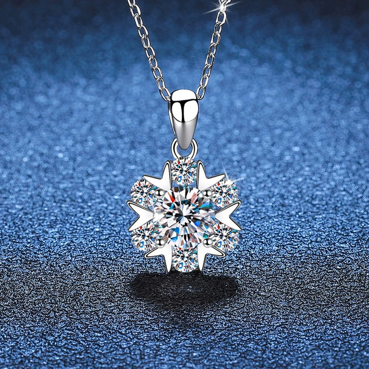 Floral Cluster Moissanite Pendant Necklace in Platinum-Plated S925 Sterling Silver blue background close-up view