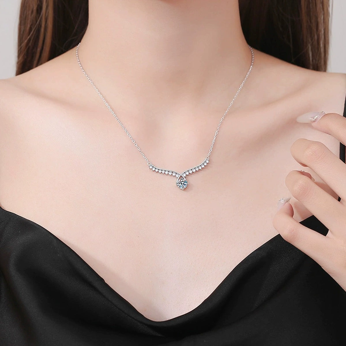 Pear Drop Moissanite Collar Necklace in Platinum-Plated S925 Sterling Silver worn on neckline by model