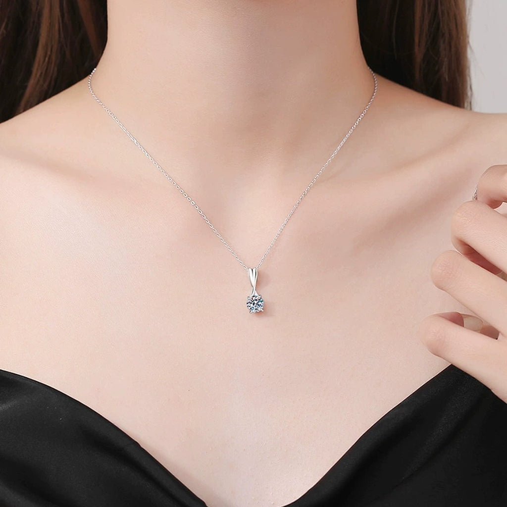 Classic Round Moissanite Solitaire Pendant Necklace in Platinum-Plated S925 Sterling Silver worn on neckline by model