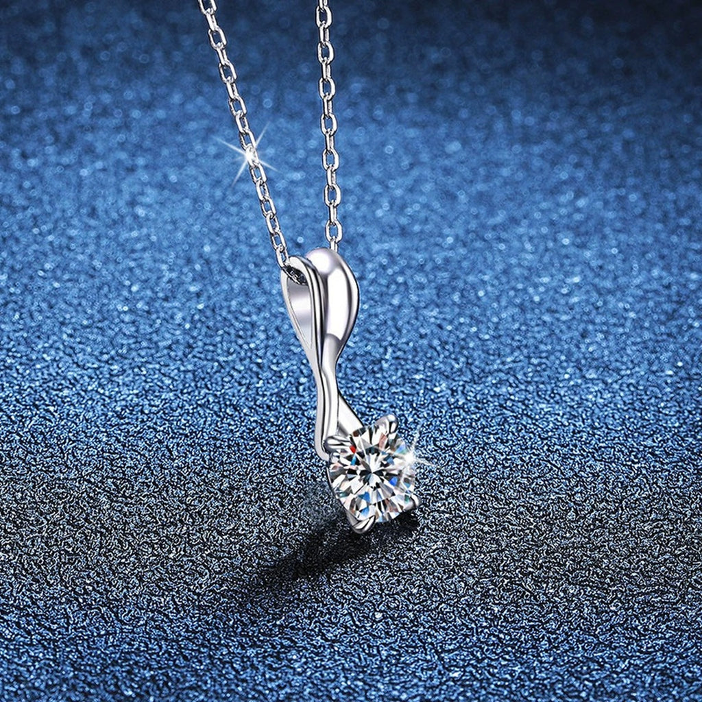 Classic Round Moissanite Solitaire Pendant Necklace in Platinum-Plated S925 Sterling Silver blue background close-up view