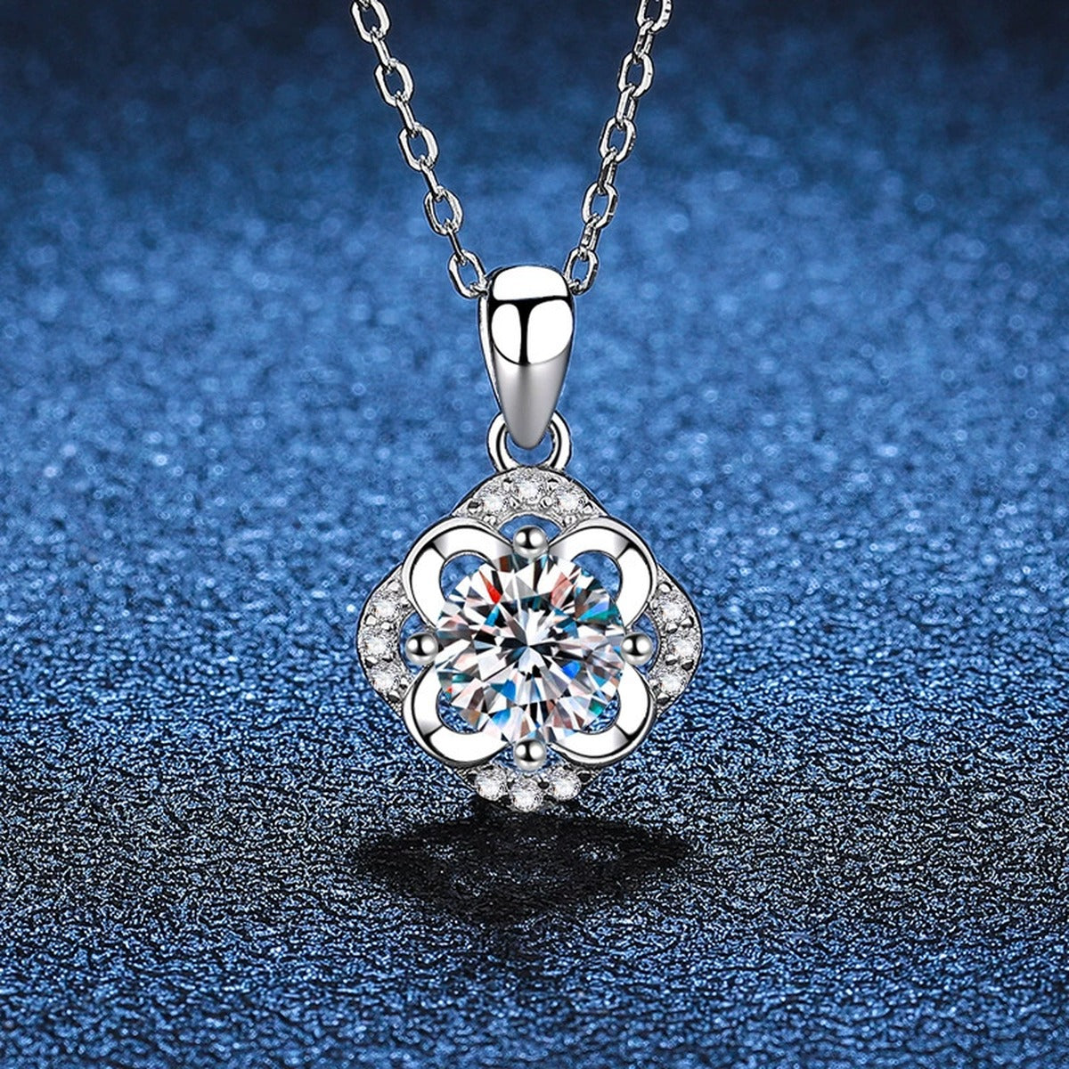 Round Floral Halo Moissanite Pendant Necklace in Platinum-Plated S925 Sterling Silver blue background product view