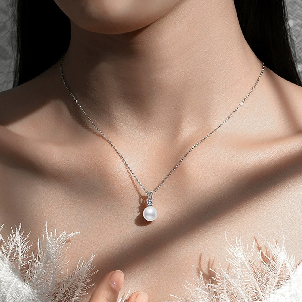 Moissanite Pearl Pendant Necklace in White Gold-Plated S925 Sterling Silver worn on neckline by model