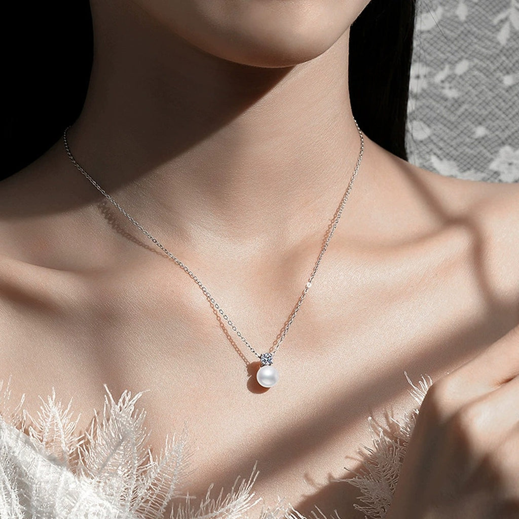 Moissanite Pearl Pendant Necklace in White Gold-Plated S925 Sterling Silver worn on neckline by model