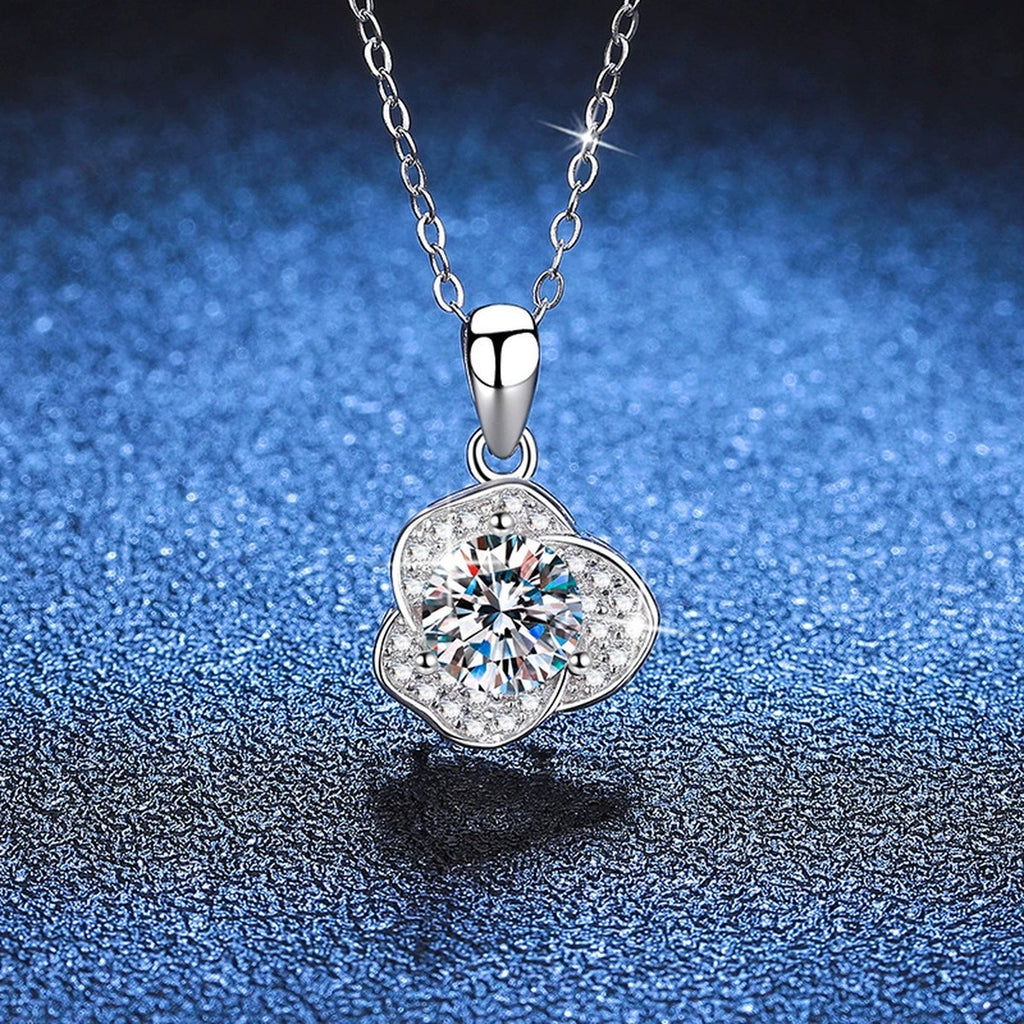 Round Clover Halo Moissanite Pendant Necklace in Platinum-Plated S925 Sterling Silver blue background close-up view