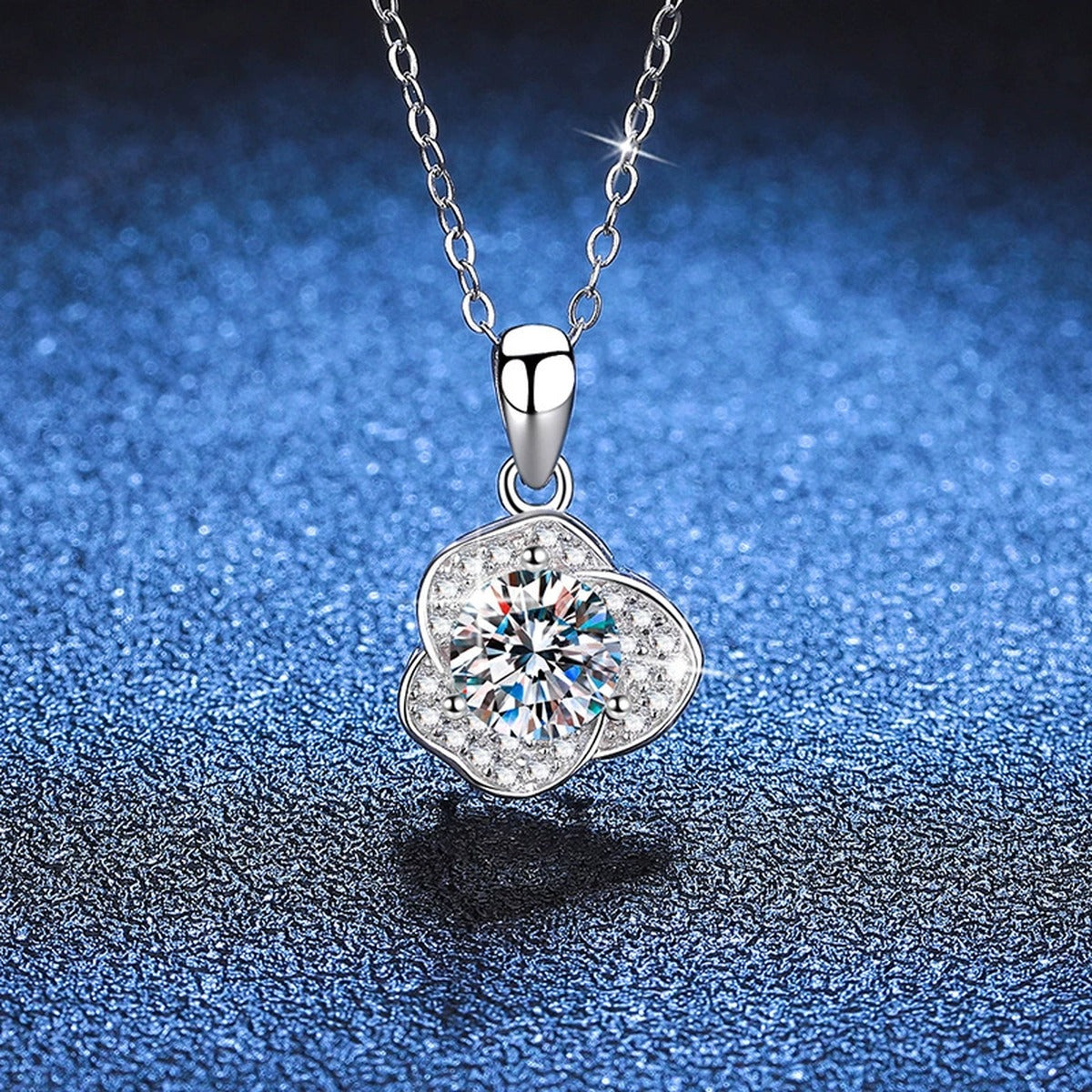 Round Clover Halo Moissanite Pendant Necklace in Platinum-Plated S925 Sterling Silver blue background close-up view