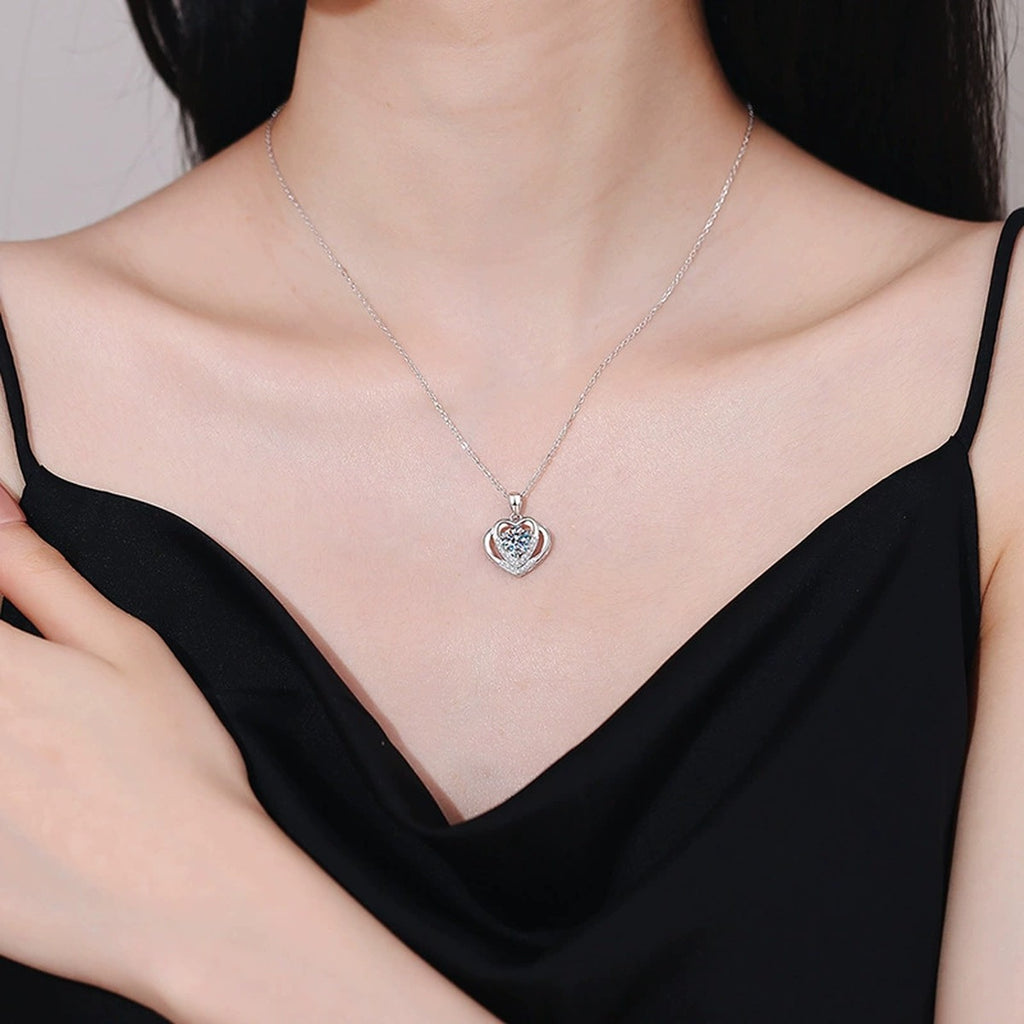 Heart Frame Moissanite Pendant Necklace in Platinum-Plated S925 Sterling Silver worn on neckline by model