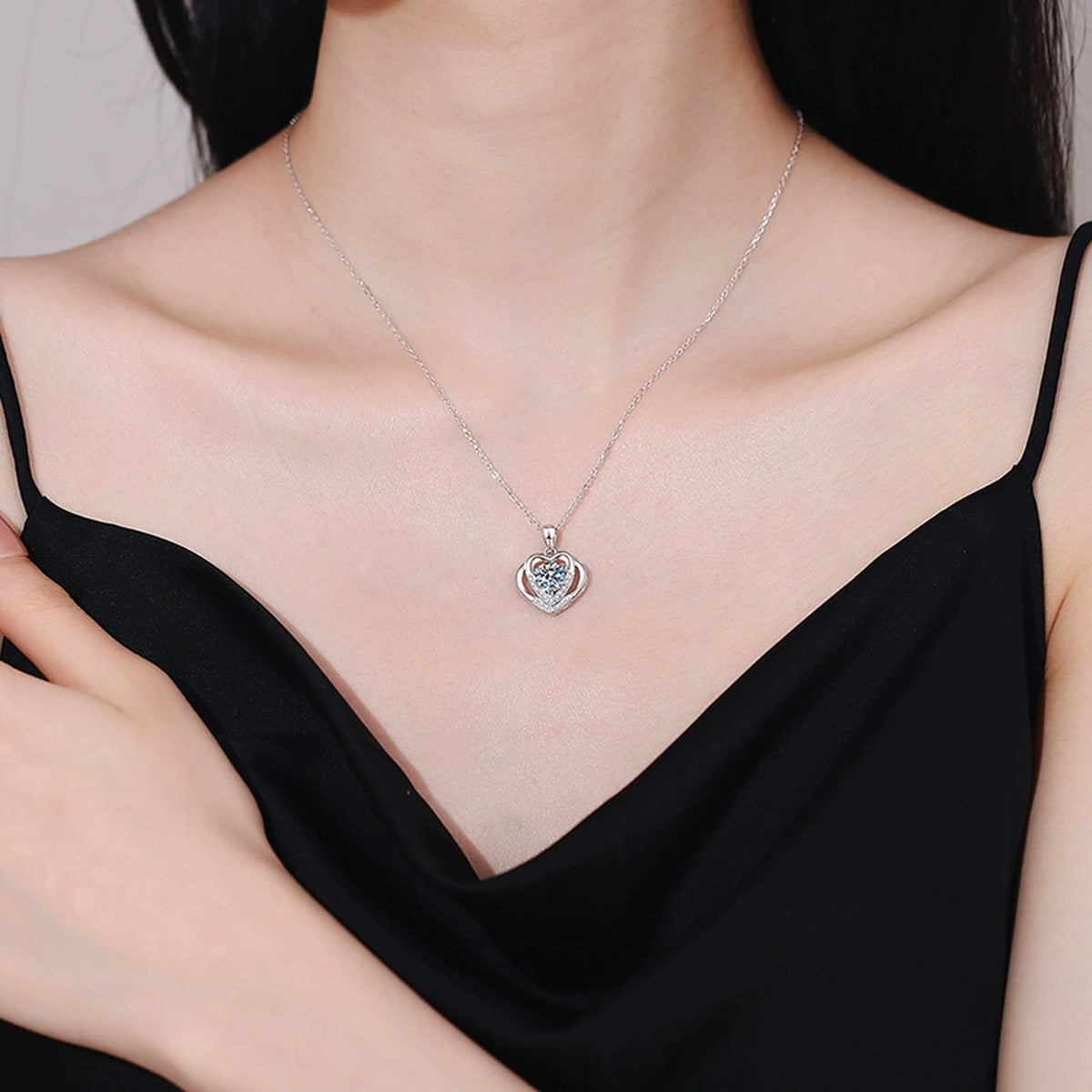 Heart Frame Moissanite Pendant Necklace in Platinum-Plated S925 Sterling Silver worn on neckline by model