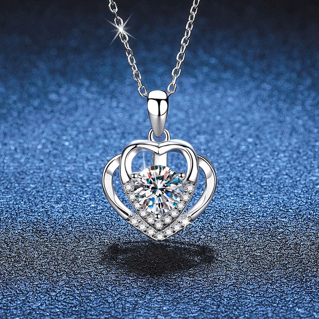 Heart Frame Moissanite Pendant Necklace in Platinum-Plated S925 Sterling Silver blue background close-up view