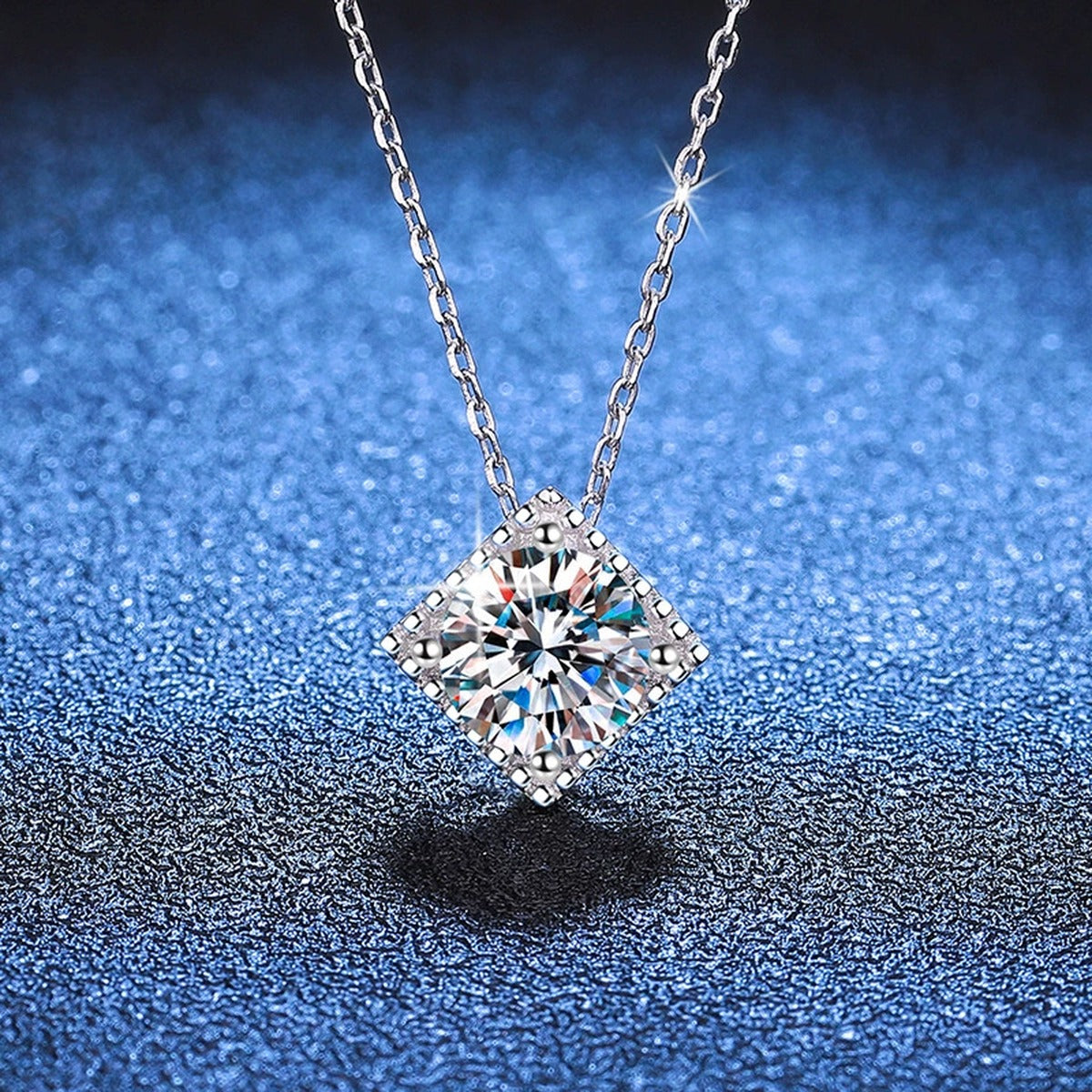 Cushion Halo Moissanite Pendant Necklace in Platinum-Plated S925 Sterling Silver blue background close-up view