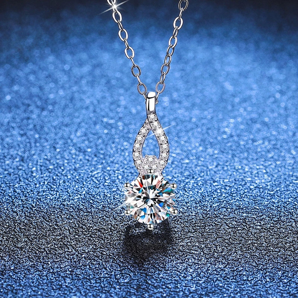 Teardrop Moissanite Pendant Necklace in Platinum-Plated S925 Sterling Silver blue background angled view