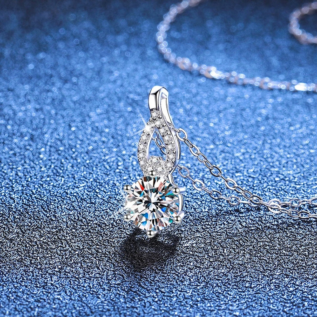 Teardrop Moissanite Pendant Necklace in Platinum-Plated S925 Sterling Silver blue background close-up view