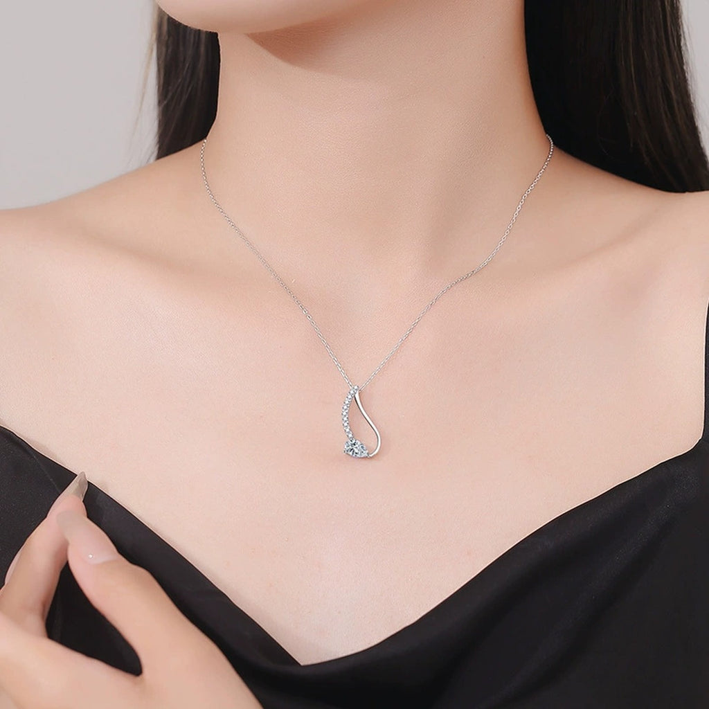 Pear-Cut Moissanite Drop Necklace in Platinum-Plated S925 Sterling Silver worn on neckline by model