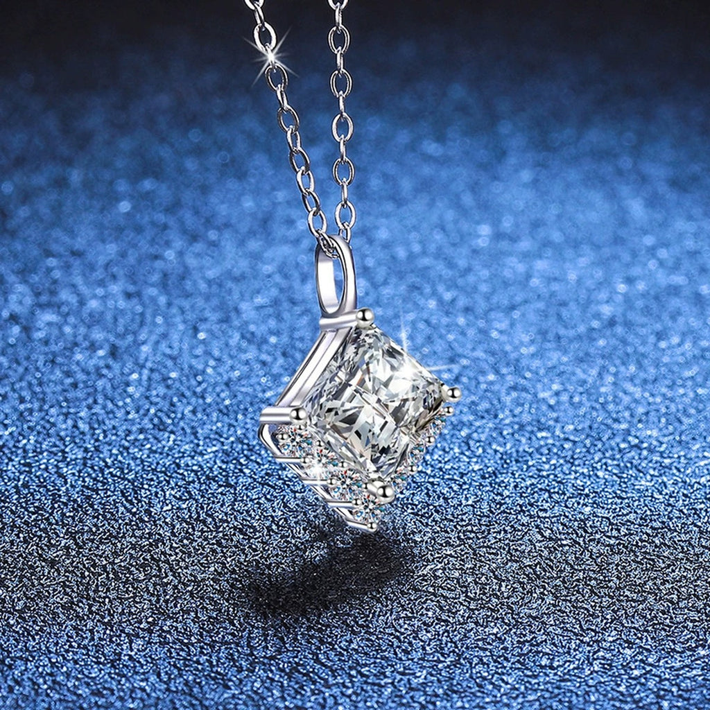 Princess-Cut Moissanite Pendant Necklace in Platinum-Plated S925 Sterling Silver blue background angled view