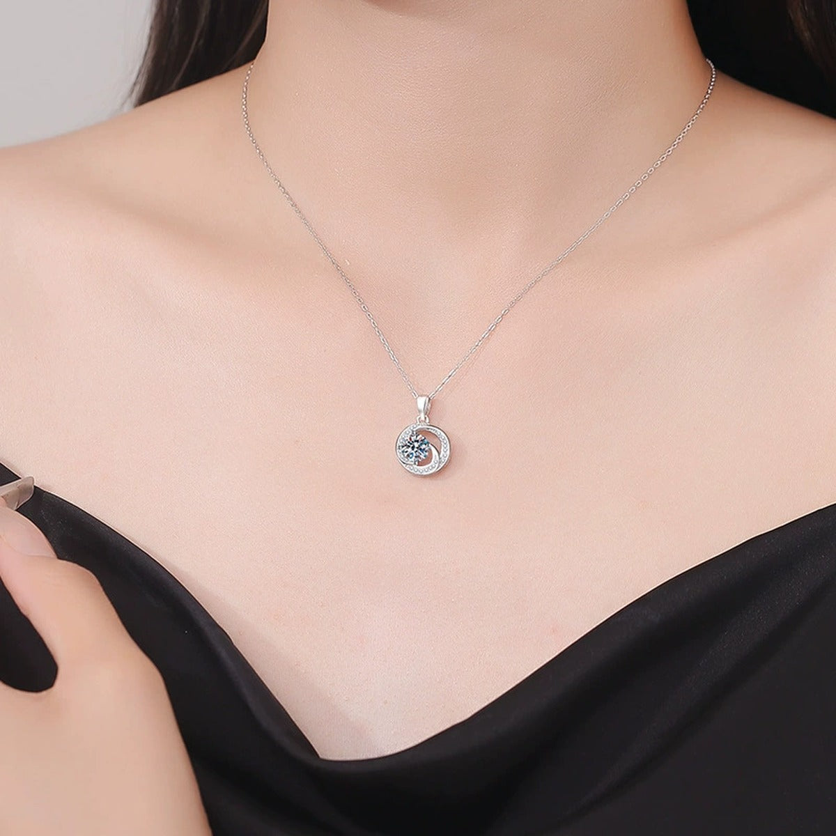 Round Bezel Halo Moissanite Pendant Necklace in Platinum-Plated S925 Sterling Silver worn on neckline by model