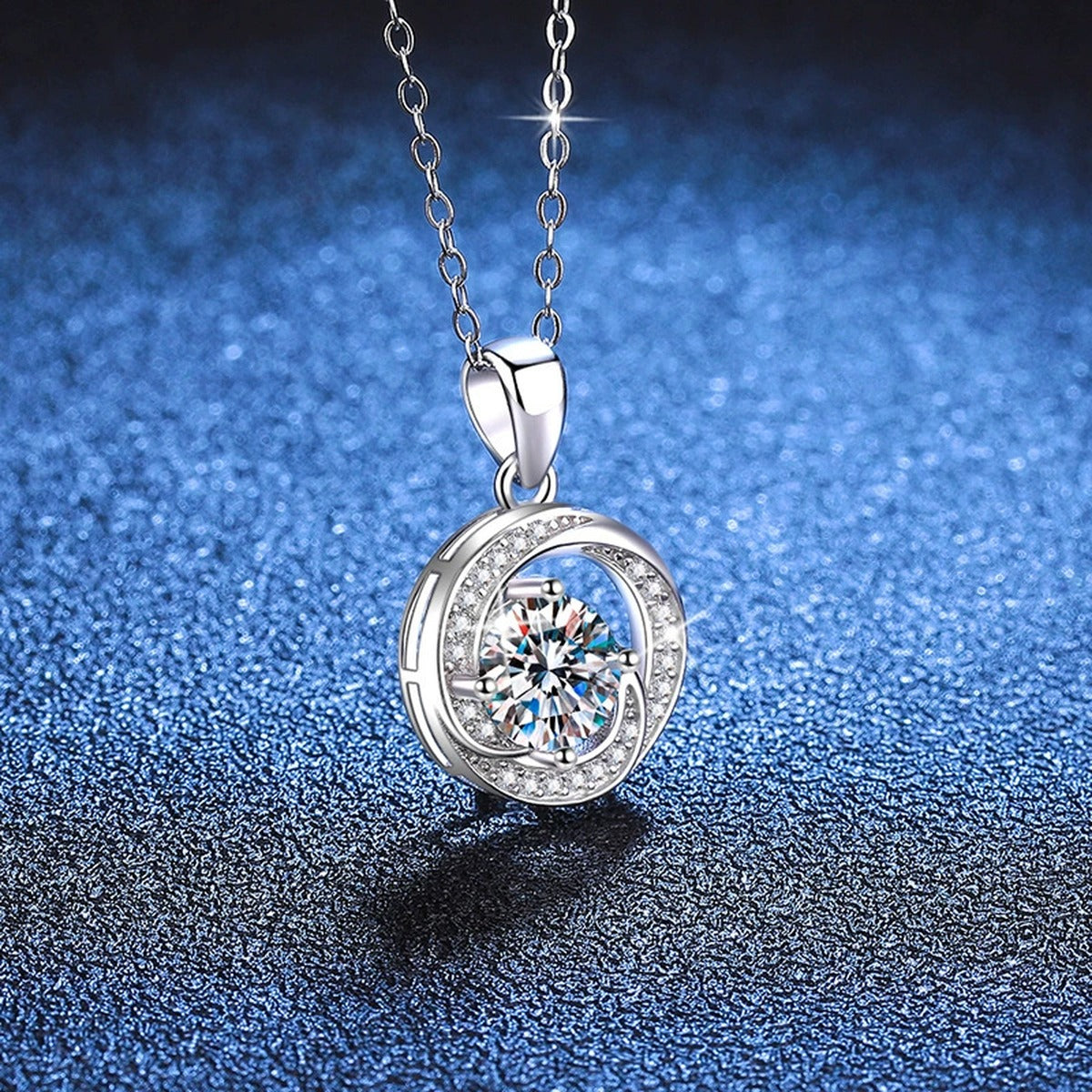 Round Bezel Halo Moissanite Pendant Necklace in Platinum-Plated S925 Sterling Silver blue background angled view