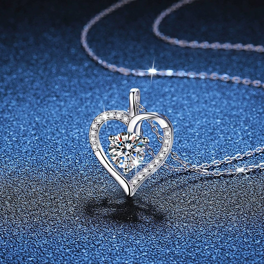 Open Heart Moissanite Pendant Necklace in Platinum-Plated S925 Sterling Silver blue background close-up view