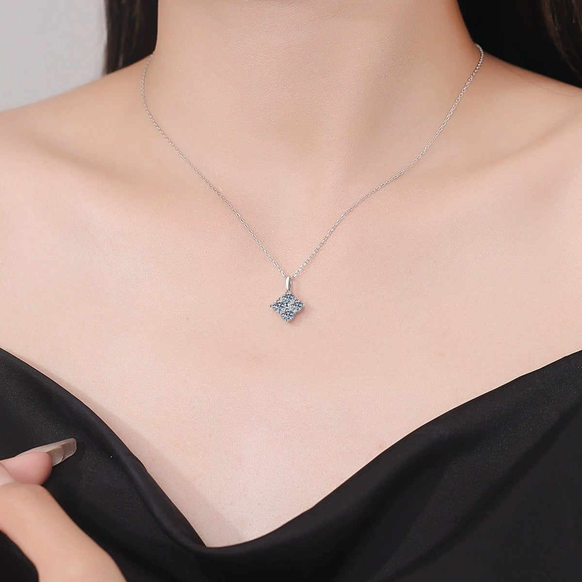 Four-Stone Cluster Moissanite Pendant Necklace in Platinum-Plated S925 Sterling Silver worn on neckline by model