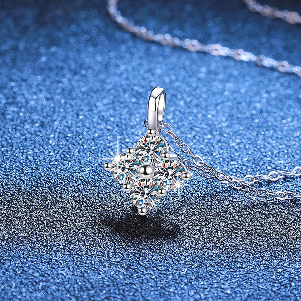 Four-Stone Cluster Moissanite Pendant Necklace in Platinum-Plated S925 Sterling Silver blue background angled view