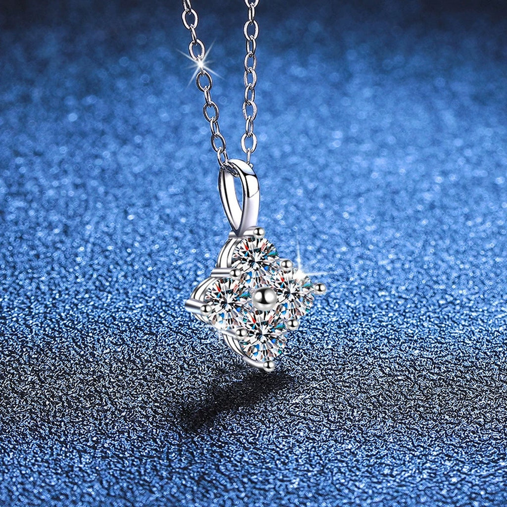 Four-Stone Cluster Moissanite Pendant Necklace in Platinum-Plated S925 Sterling Silver blue background close-up view