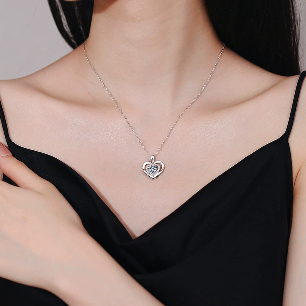 Heart Halo Moissanite Pendant Necklace in Platinum-Plated S925 Sterling Silver worn on neckline by model