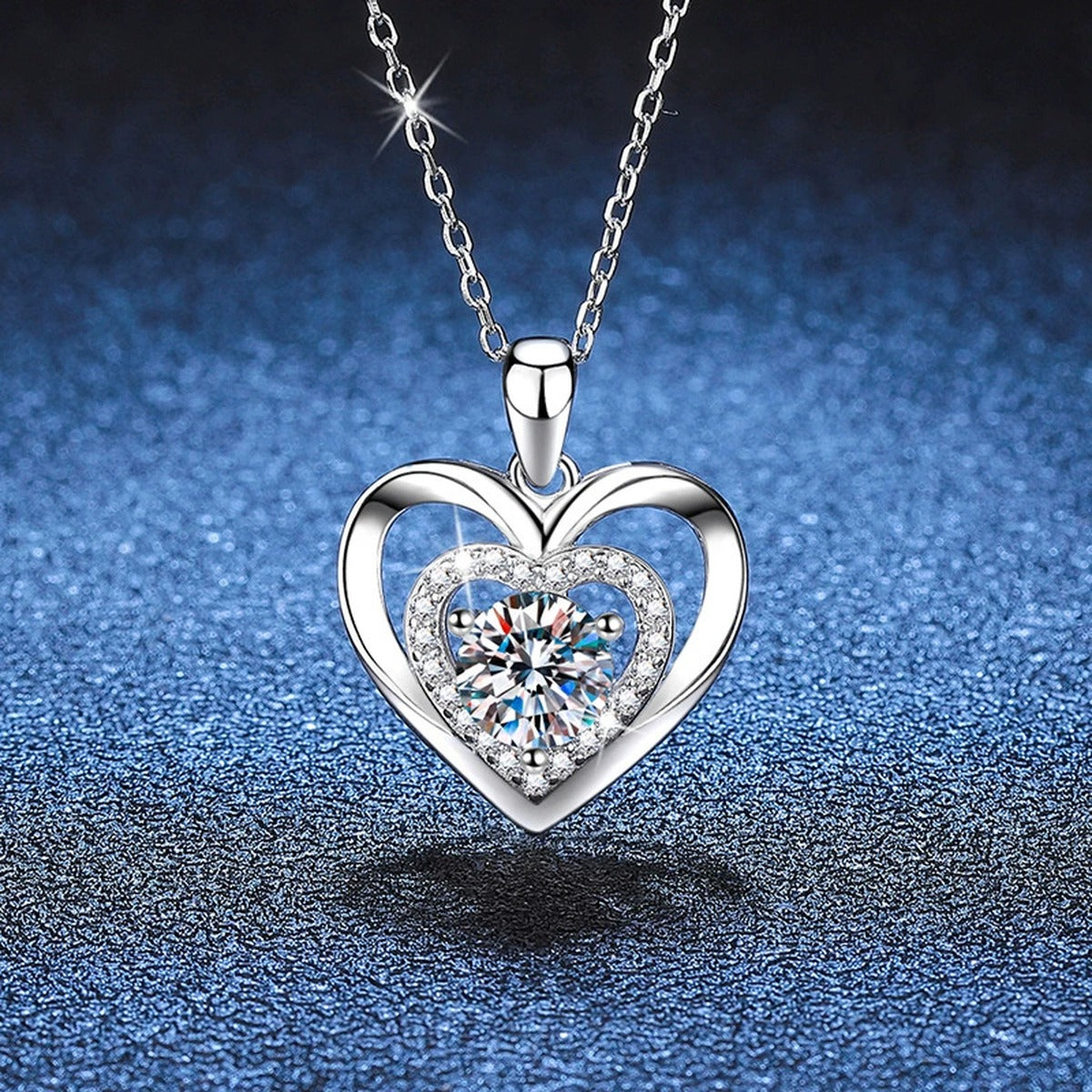 Heart Halo Moissanite Pendant Necklace in Platinum-Plated S925 Sterling Silver blue background angled view
