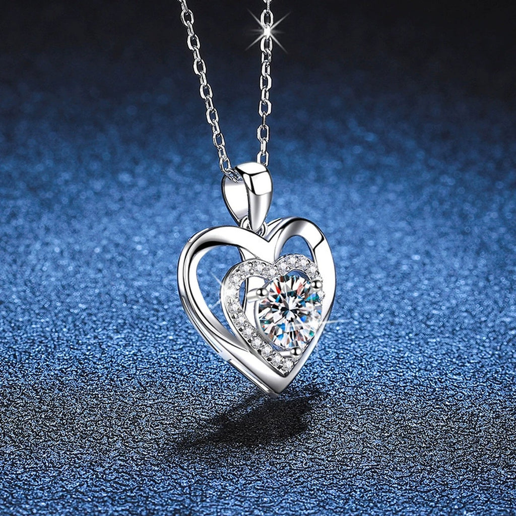 Heart Halo Moissanite Pendant Necklace in Platinum-Plated S925 Sterling Silver blue background close-up view
